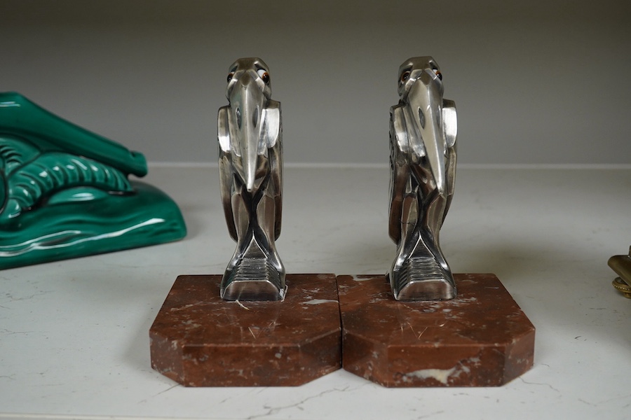 A pair of French Art Deco silvered metal bookends by H Moreau, 14cm high. Condition - one restored